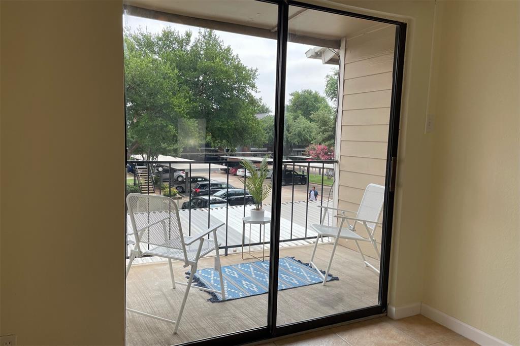 4748 Old Bent Tree Lane, Unit 1404 Dallas, TX 75287 - Photo 18 of 25 a view of a room with wooden floor and balcony