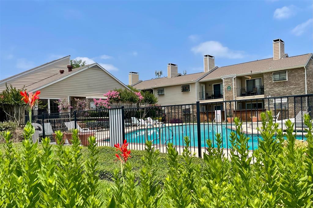 4748 Old Bent Tree Lane, Unit 1404 Dallas, TX 75287 - Photo 21 of 25 a view of a house with wooden fence