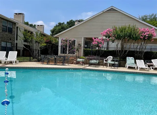 a front view of house with yard and outdoor seating