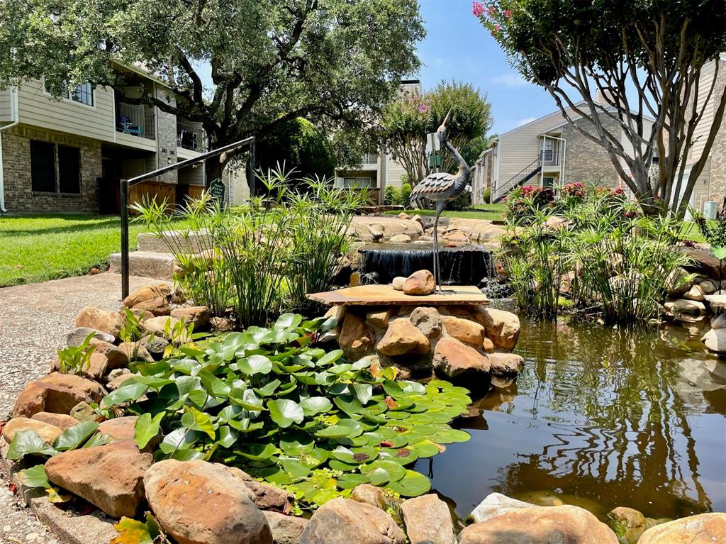 4748 Old Bent Tree Lane, Unit 1404 Dallas, TX 75287 - Photo 25 of 25 a backyard of a house with lots of green space and garden view