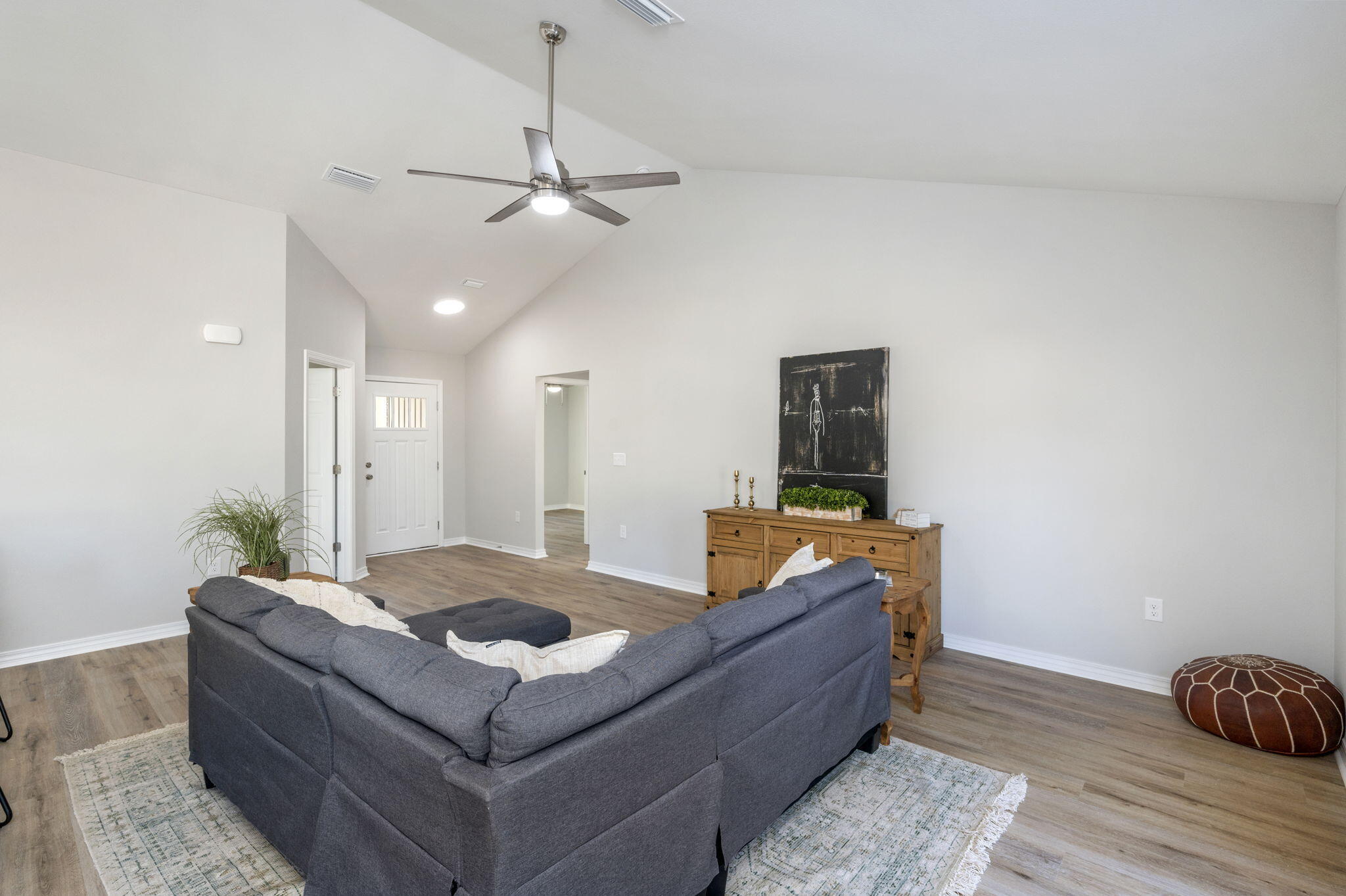 5362 Cox Lane Crestview, FL 32539 - Photo 12 of 29 a living room with furniture and a wooden floor