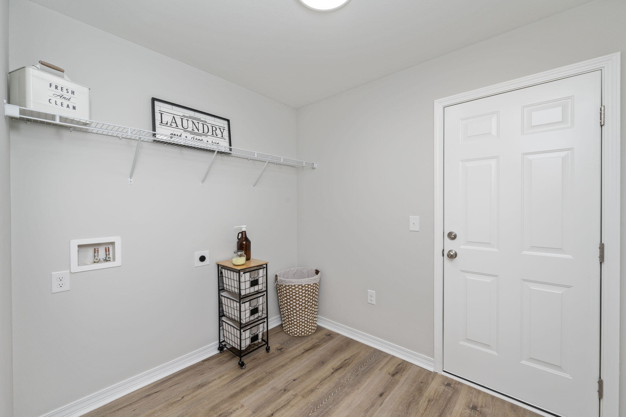 5362 Cox Lane Crestview, FL 32539 - Photo 27 of 29 a view of a hallway with wooden floor and closet