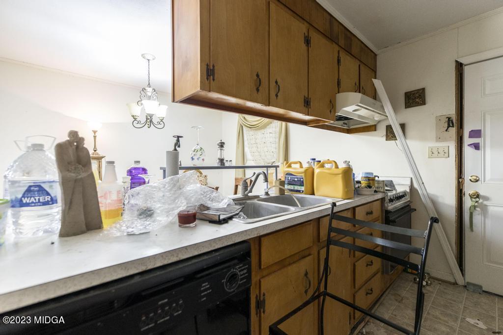 7369 Thomaston Road Macon, GA 31220 - Photo 11 of 25 a kitchen with a sink cabinets and appliances