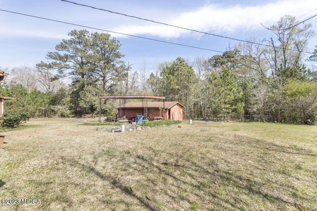 7369 Thomaston Road Macon, GA 31220 - Photo 17 of 25 a view of a yard with a tree