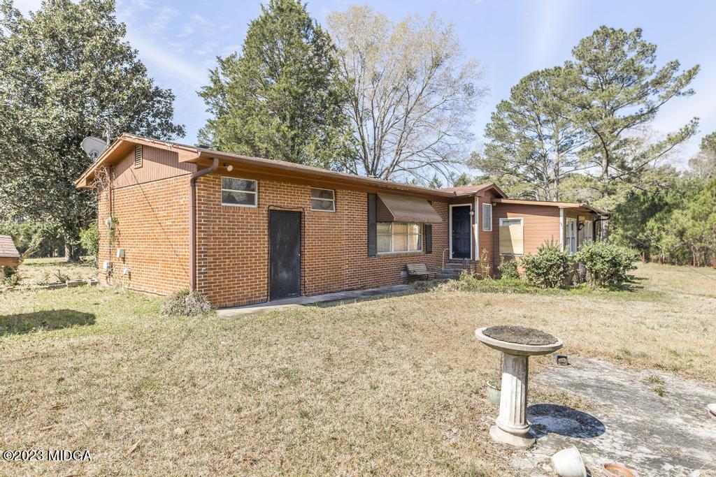 7369 Thomaston Road Macon, GA 31220 - Photo 19 of 25 a view of a house with a yard