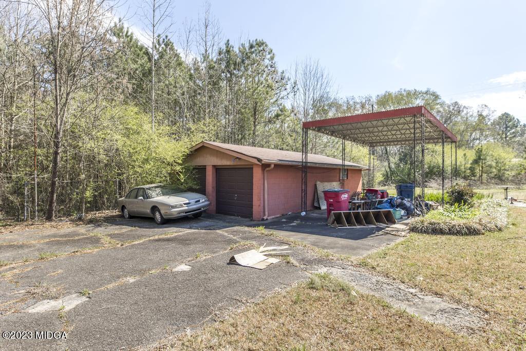 7369 Thomaston Road Macon, GA 31220 - Photo 22 of 25 a view of a car is parked in front of a house