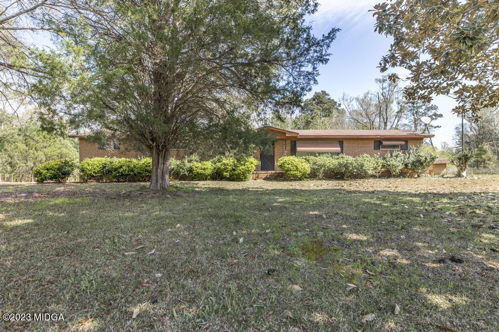 7369 Thomaston Road Macon, GA 31220 - Photo 5 of 25 a view of a house with yard and a tree