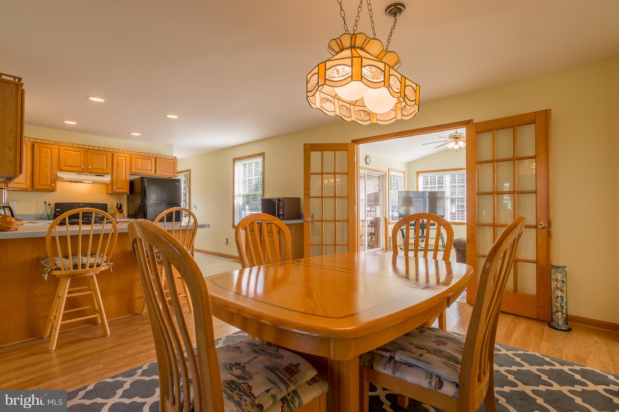 104 Falls Road Milton, DE 19968 - Photo 7 of 29 Kitchen is open to dining area and sunroom.