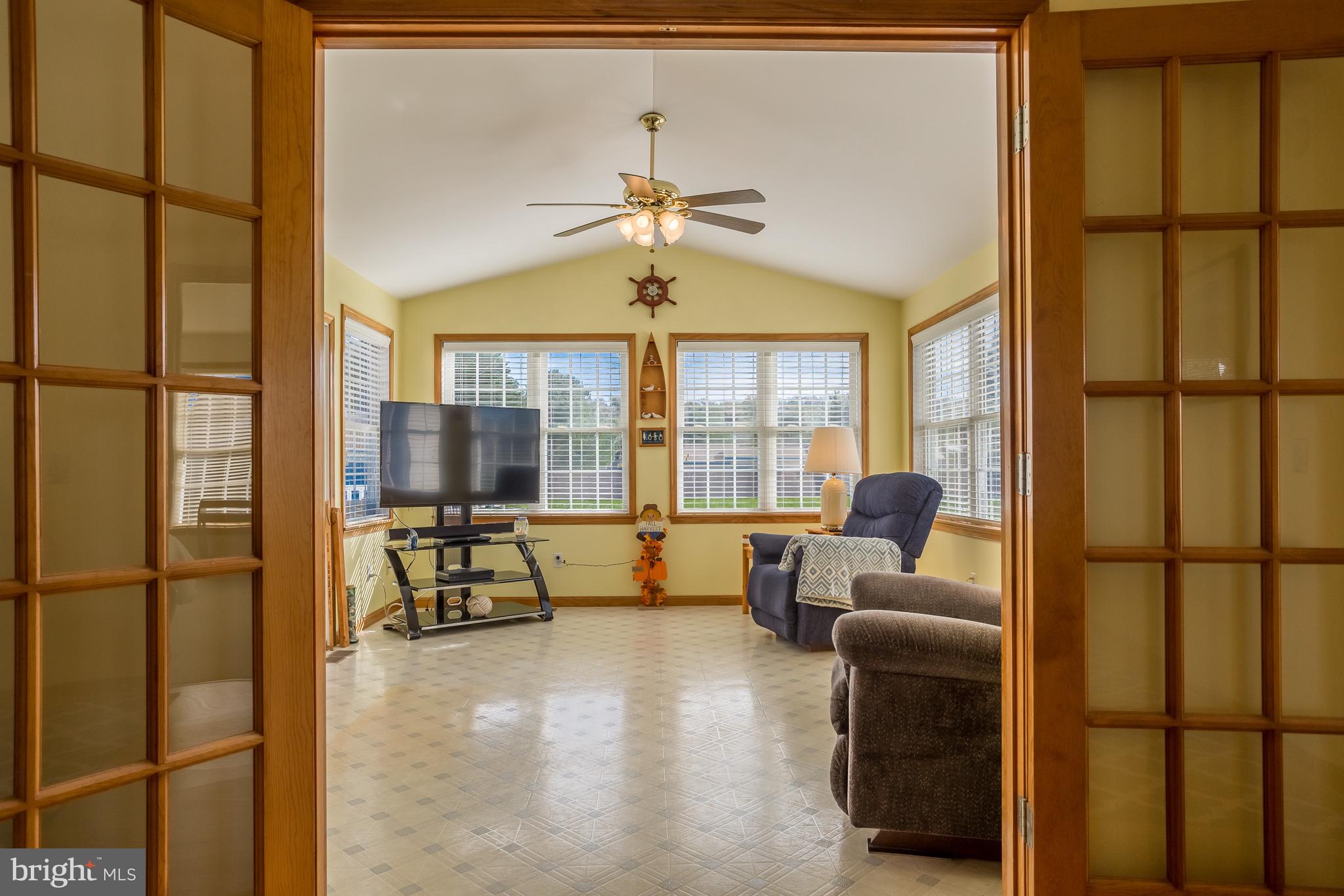104 Falls Road Milton, DE 19968 - Photo 10 of 29 French doors open to sunroom.