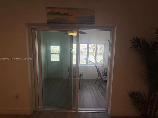 a view of a livingroom from a hallway