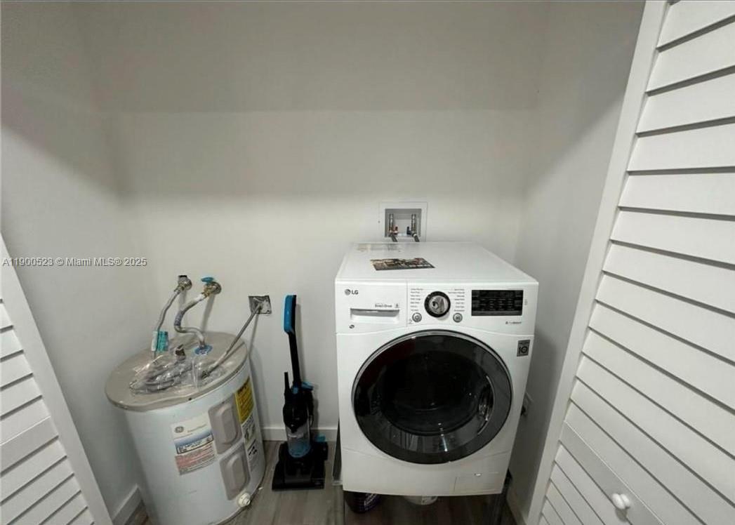 18900 Northeast 3rd Court, Unit 509 Miami, FL 33179 - Photo 19 of 19 a utility room with dryer and washer