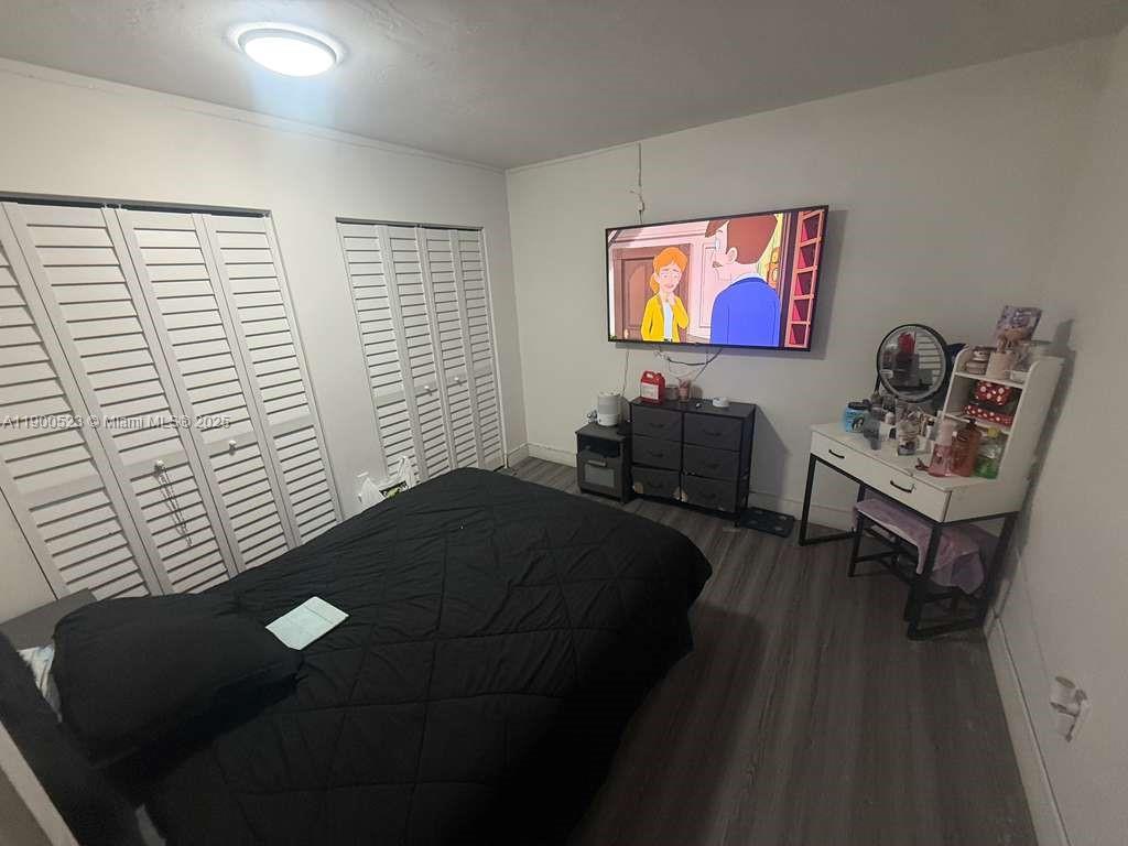 18900 Northeast 3rd Court, Unit 509 Miami, FL 33179 - Photo 9 of 19 a bedroom with furniture and a window