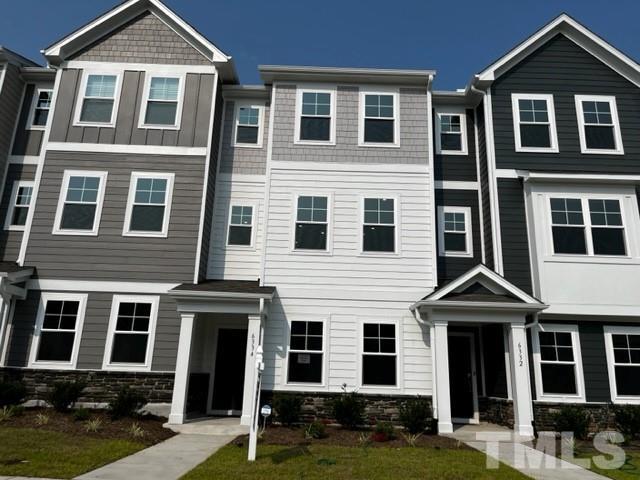 6334 Perry Creek Road, Unit 1347 Raleigh, NC 27616 - Photo 1 of 22 view from street with landscaping.