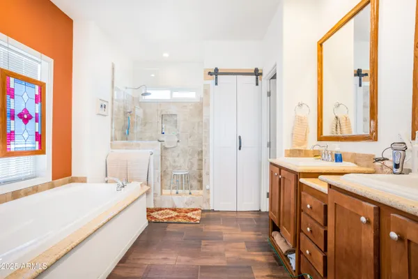 a white bath tub sitting next to a window