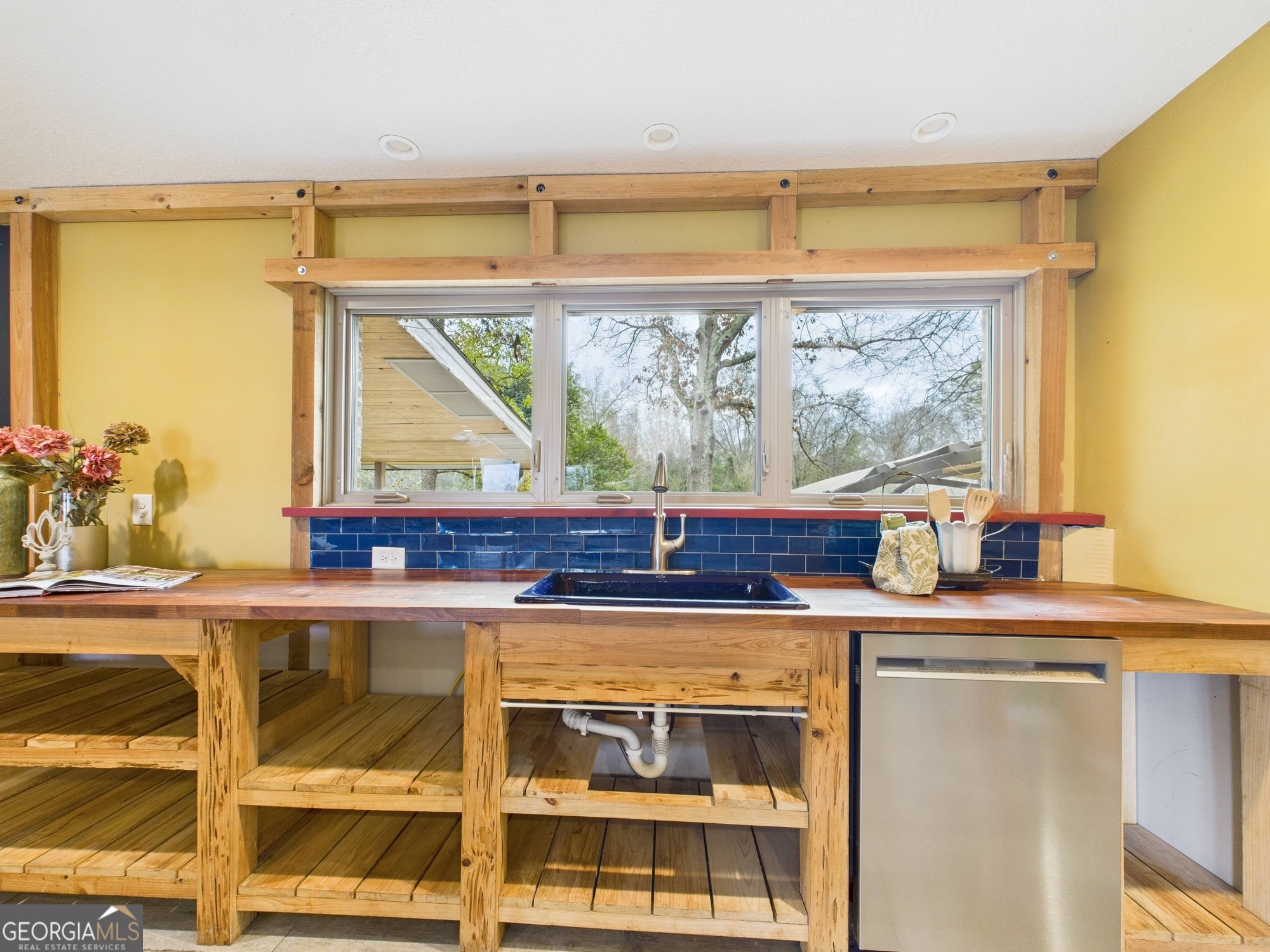 312 Henson Road Hawkinsville, GA 31036 - Photo 12 of 64 a kitchen with a sink and a large window