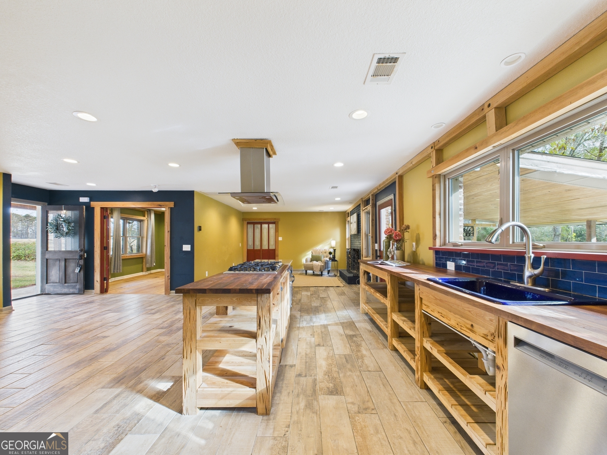 312 Henson Road Hawkinsville, GA 31036 - Photo 14 of 64 a view of a kitchen with stainless steel appliances granite countertop a stove and a wooden floors