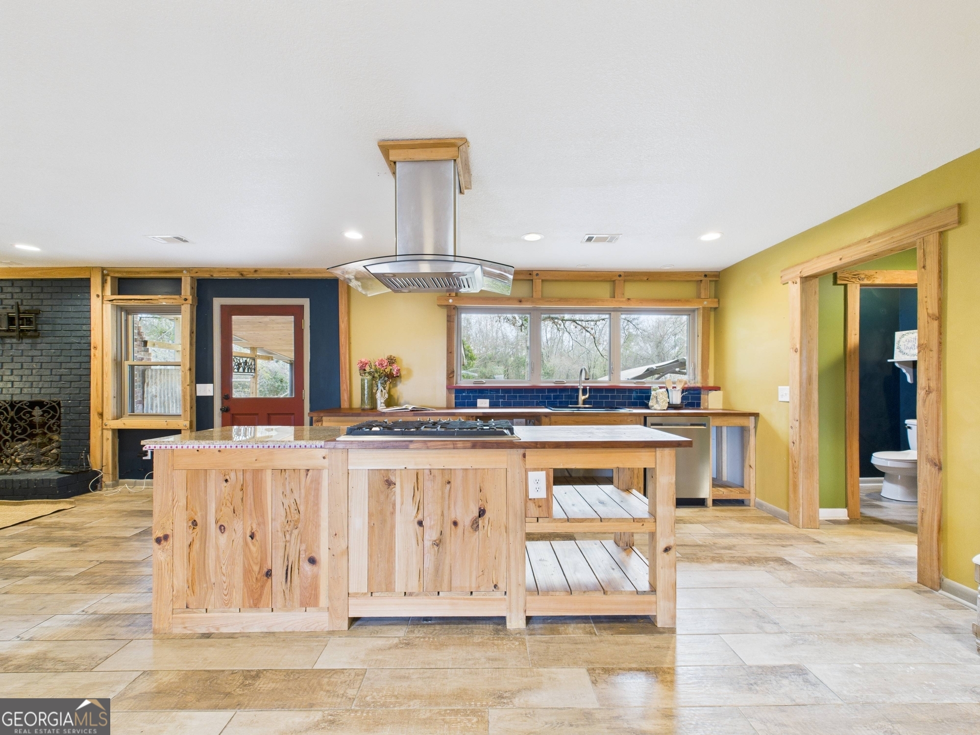 312 Henson Road Hawkinsville, GA 31036 - Photo 15 of 64 a large white kitchen with a large window