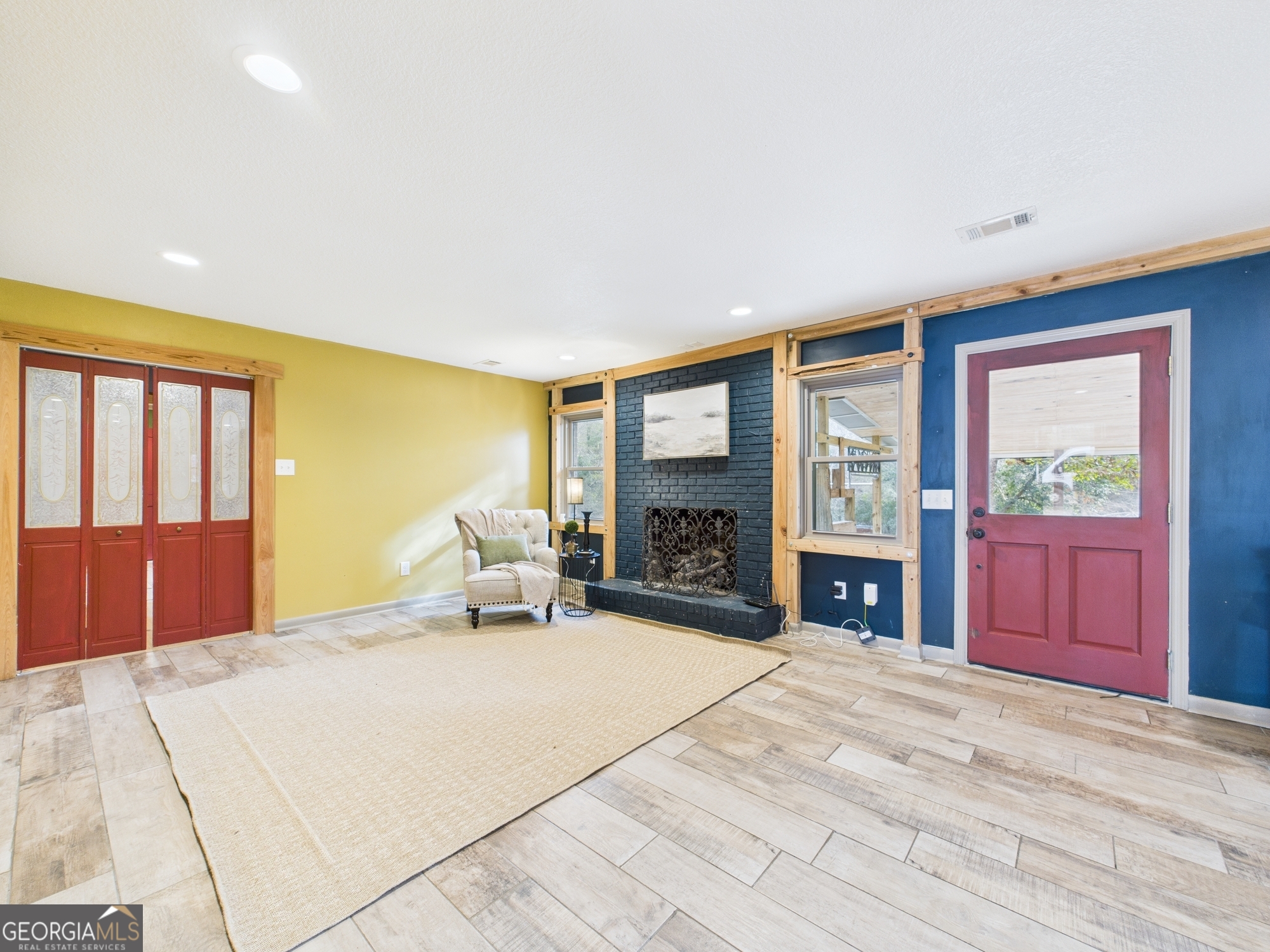 312 Henson Road Hawkinsville, GA 31036 - Photo 17 of 64 a bedroom with a bed and a large window with outer view