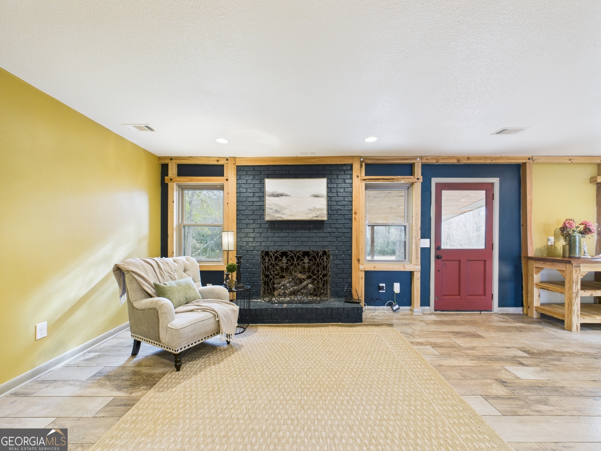 312 Henson Road Hawkinsville, GA 31036 - Photo 18 of 64 a living room with fireplace furniture and a large window
