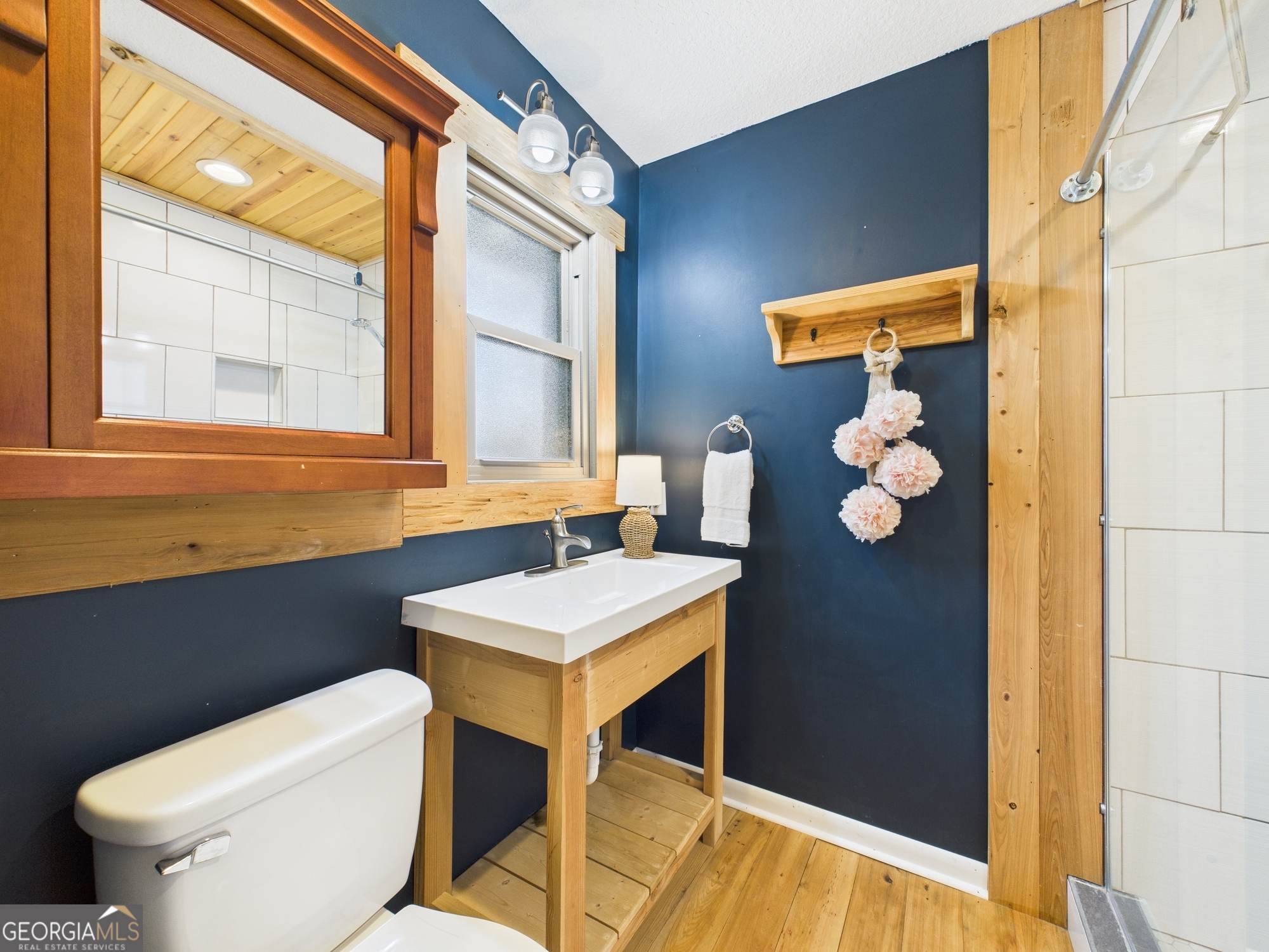 312 Henson Road Hawkinsville, GA 31036 - Photo 23 of 64 a bathroom with a sink a toilet and a mirror