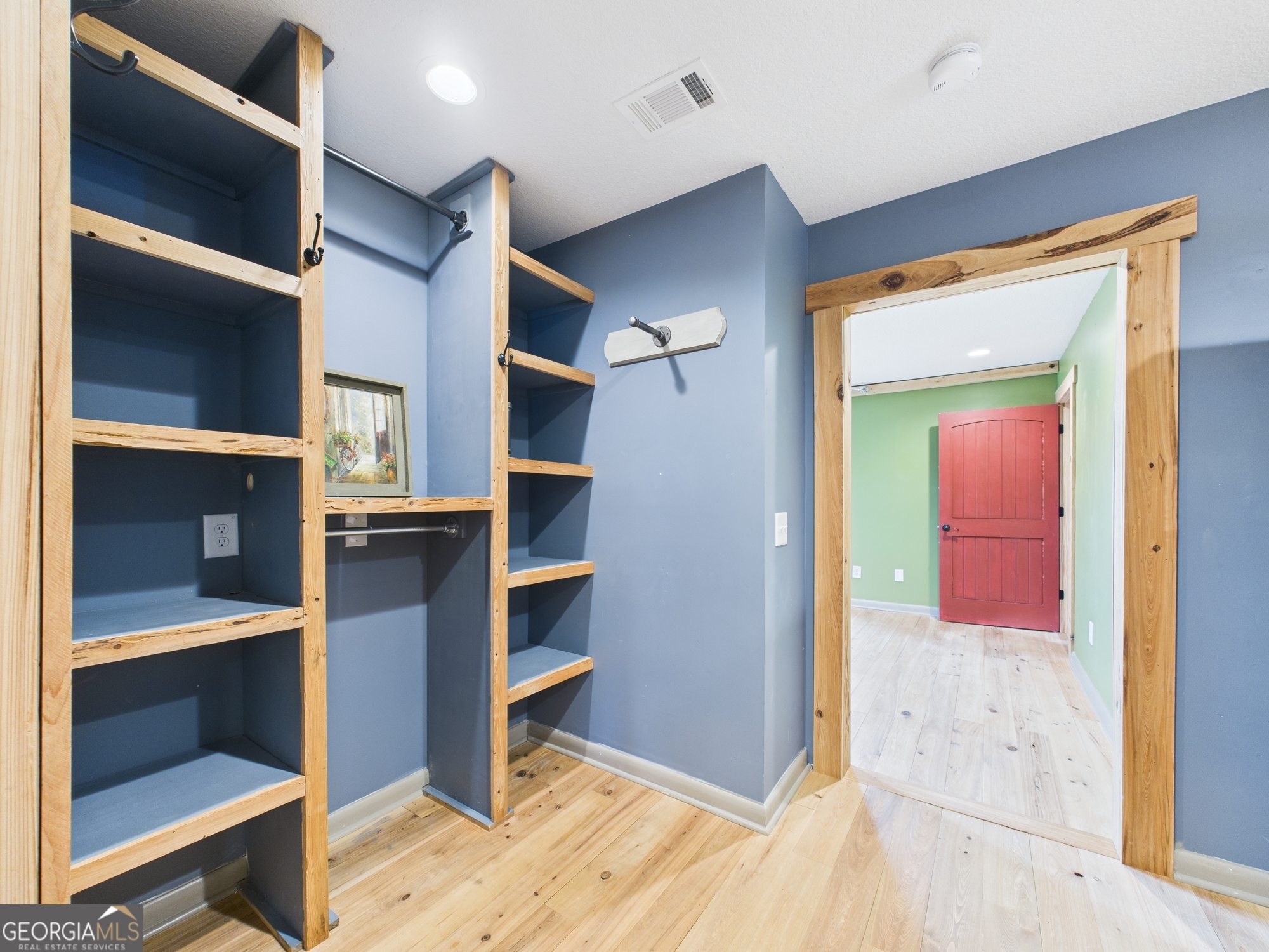 312 Henson Road Hawkinsville, GA 31036 - Photo 27 of 64 a view of walk in closet with empty racks