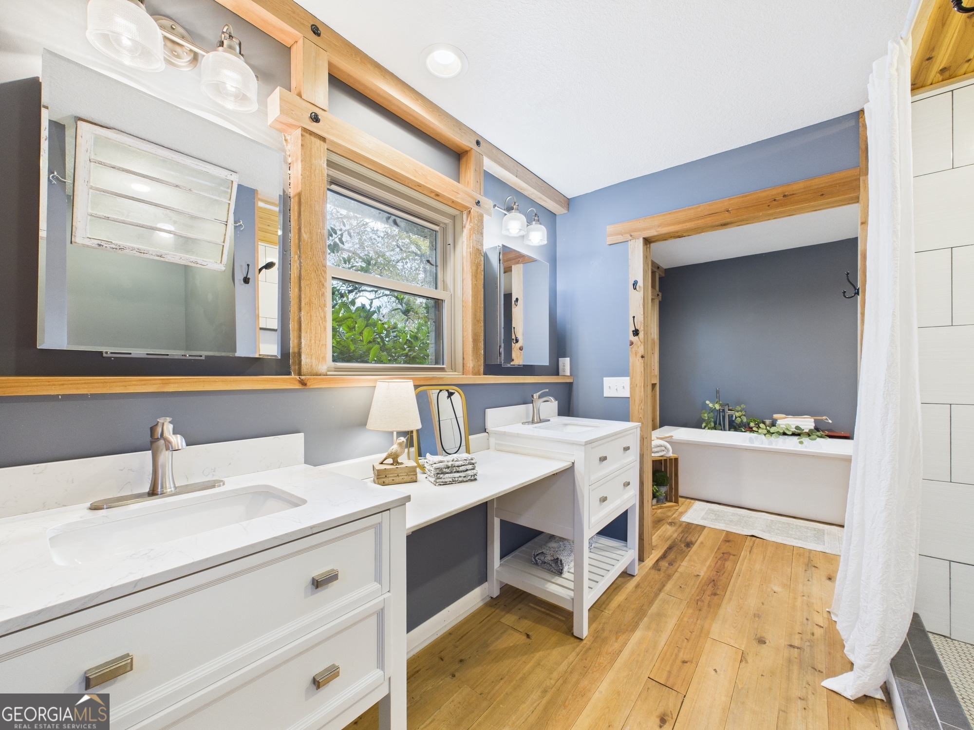 312 Henson Road Hawkinsville, GA 31036 - Photo 33 of 64 a bathroom with a double vanity sink mirror and bathtub