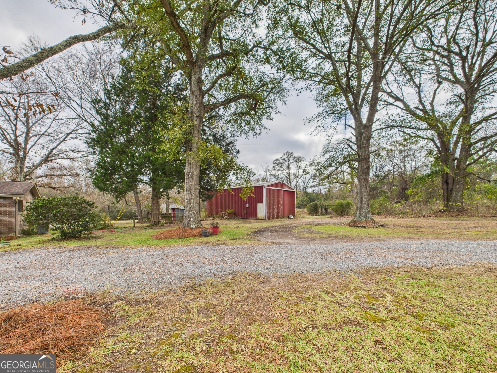 312 Henson Road Hawkinsville, GA 31036 - Photo 57 of 64 a house with trees in front of it