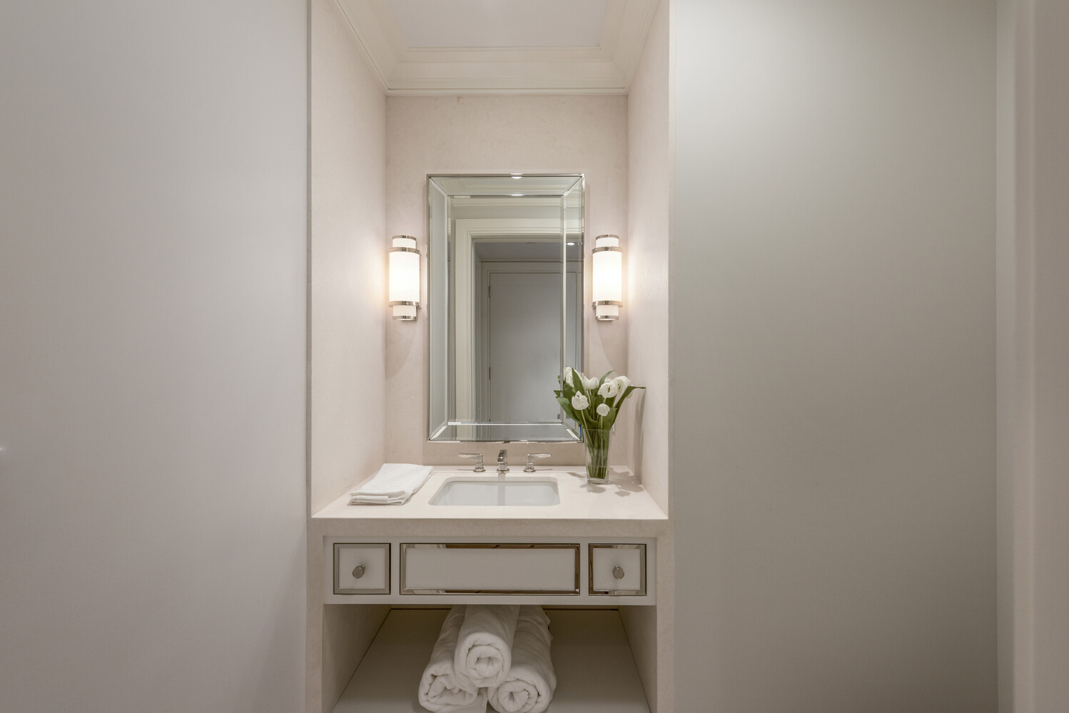33 East 74th Street, Unit 5A Manhattan, NY 10021 - Photo 12 of 22 a bathroom with a sink and a mirror