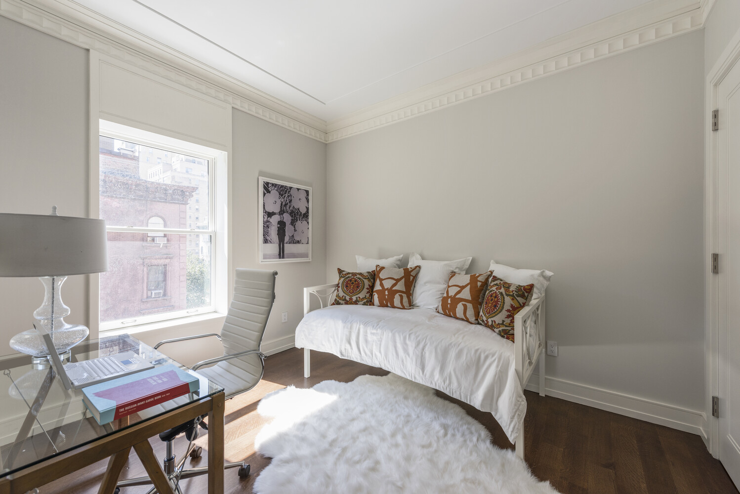 33 East 74th Street, Unit 5A Manhattan, NY 10021 - Photo 13 of 22 a bedroom with a bed and wooden floor
