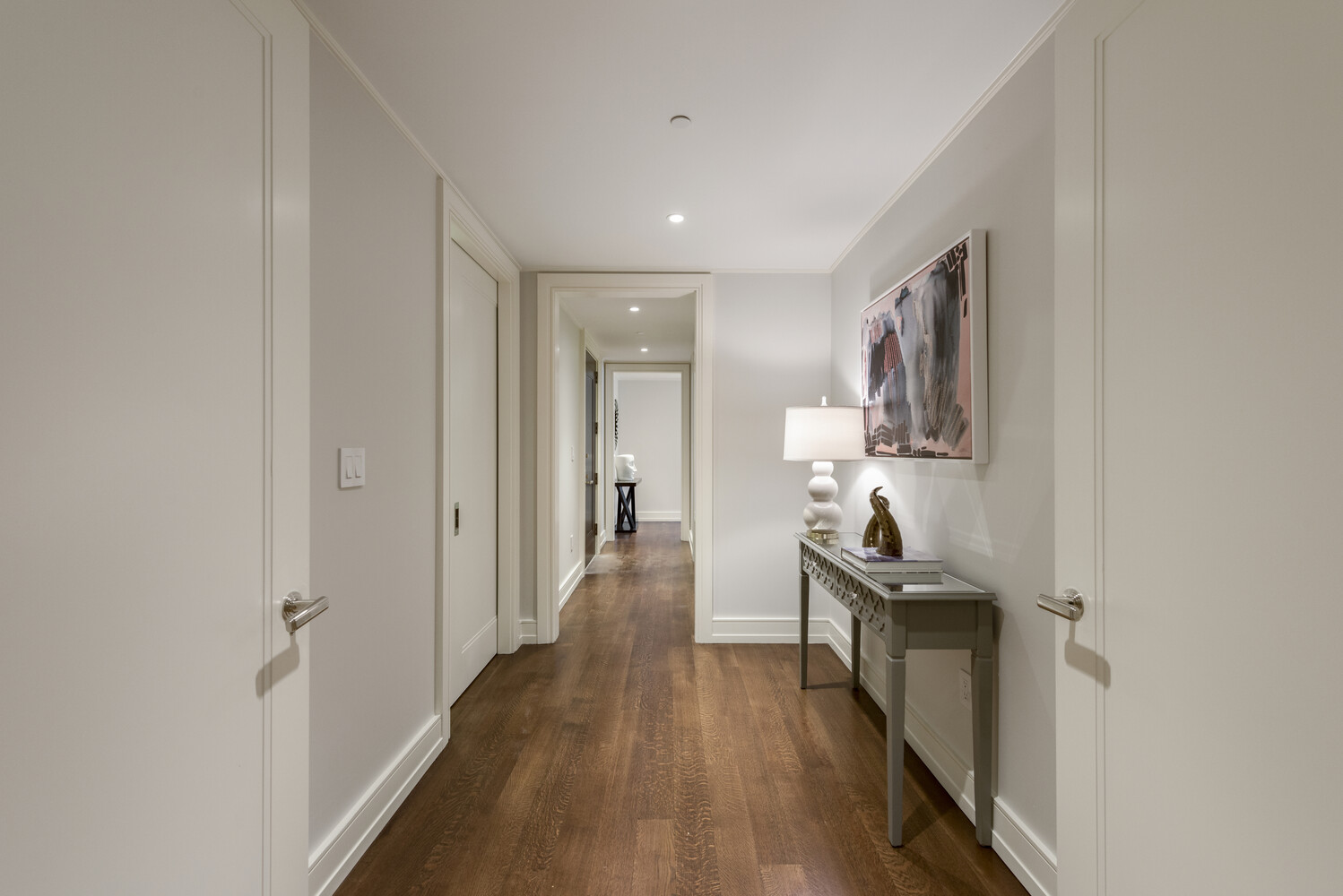 33 East 74th Street, Unit 5A Manhattan, NY 10021 - Photo 15 of 22 a view of a hallway with wooden floor and furniture