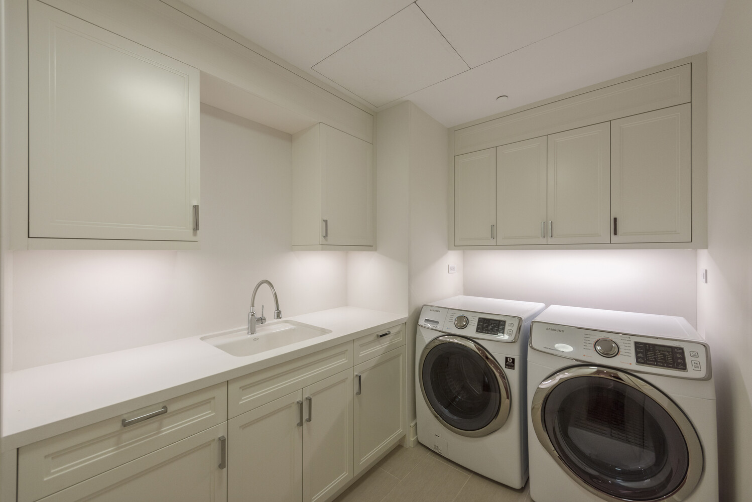 33 East 74th Street, Unit 5A Manhattan, NY 10021 - Photo 16 of 22 a utility room with sink dryer and washer