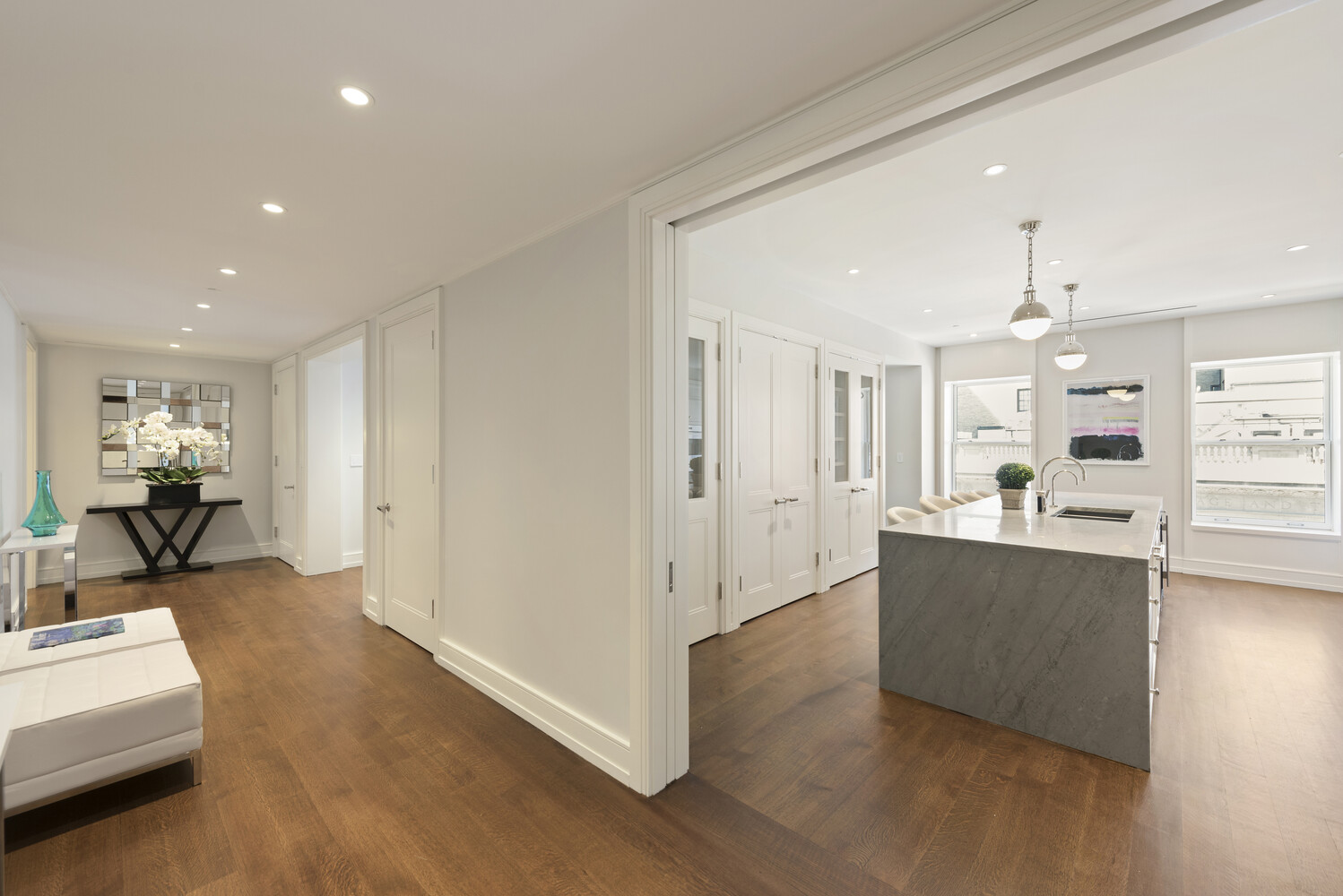 33 East 74th Street, Unit 5A Manhattan, NY 10021 - Photo 2 of 22 a view of a living room kitchen and a wooden floor
