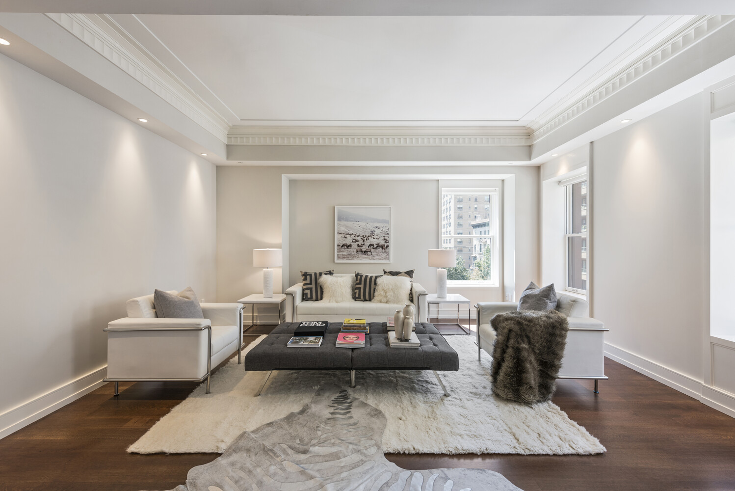 33 East 74th Street, Unit 5A Manhattan, NY 10021 - Photo 3 of 22 a living room with furniture window and wooden floor