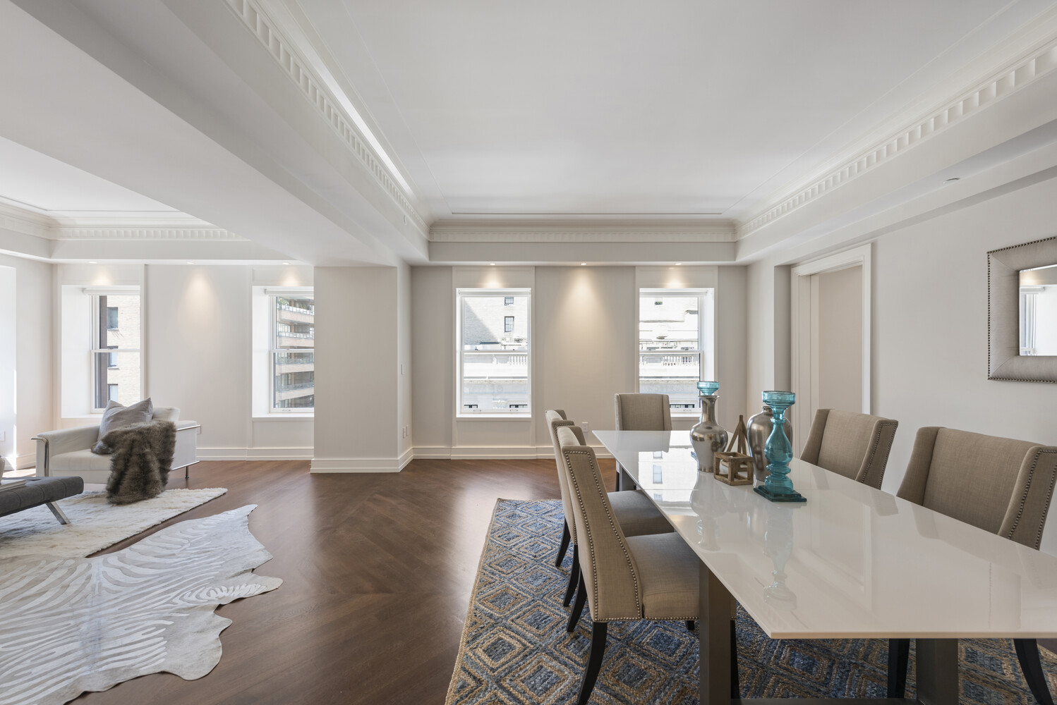 33 East 74th Street, Unit 5A Manhattan, NY 10021 - Photo 4 of 22 a view of a dining room with furniture and wooden floor
