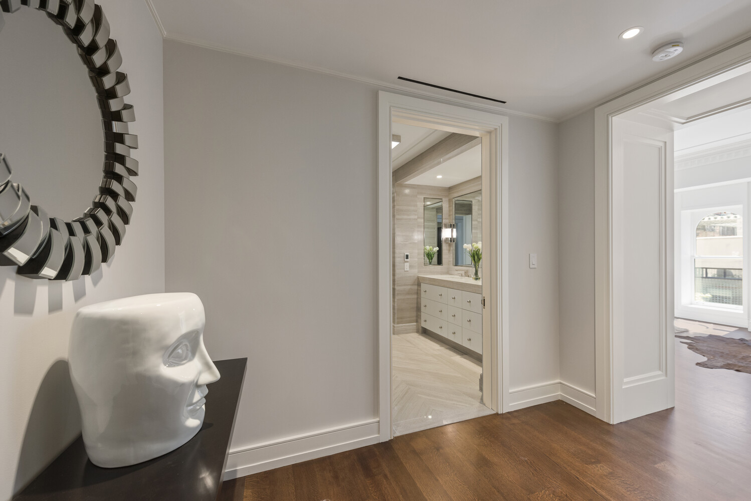 33 East 74th Street, Unit 5A Manhattan, NY 10021 - Photo 8 of 22 a view of a hallway and wooden floor and a dining room
