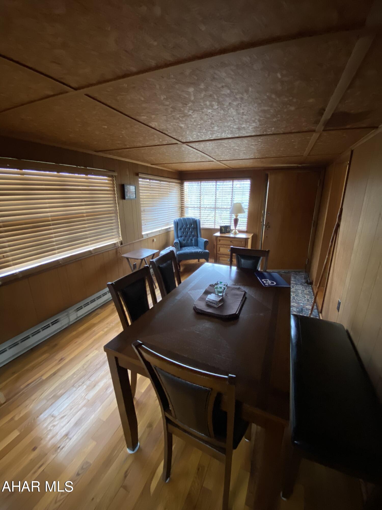 157 Stuckeysville Road Manns Choice, PA 15550 - Photo 14 of 28 a view of a dining room with furniture window and wooden floor