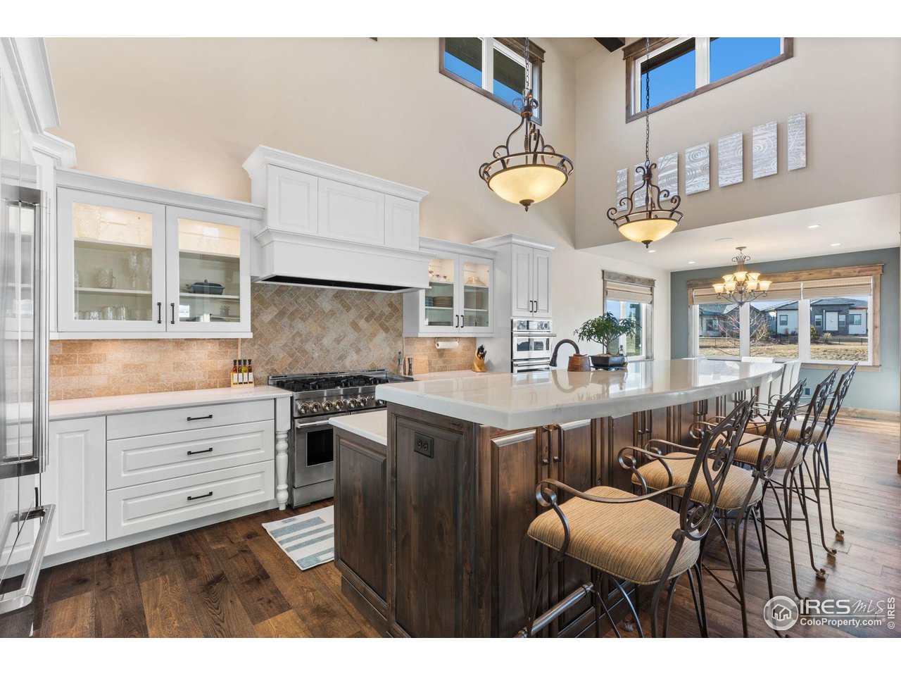 2770 Heron Lakes Parkway Berthoud, CO 80513 - Photo 11 of 40 a kitchen with a stove window and cabinets