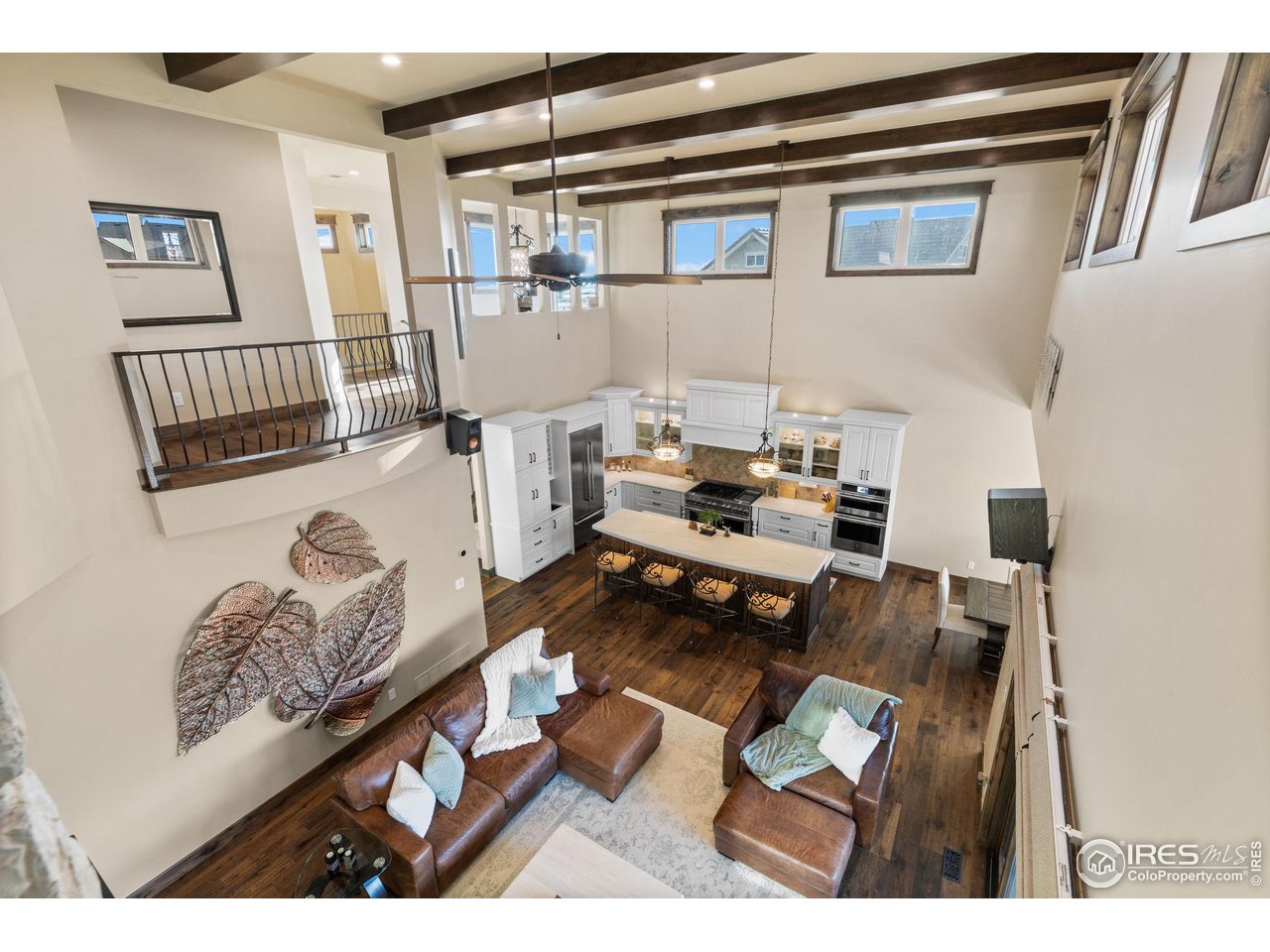 2770 Heron Lakes Parkway Berthoud, CO 80513 - Photo 13 of 40 a living room with furniture and a rug