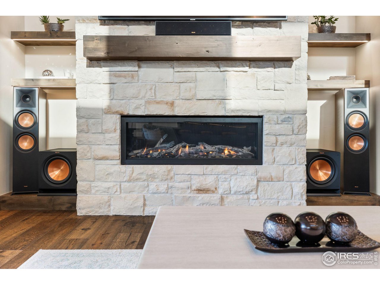 2770 Heron Lakes Parkway Berthoud, CO 80513 - Photo 16 of 40 a close view of a fireplace and wooden floor