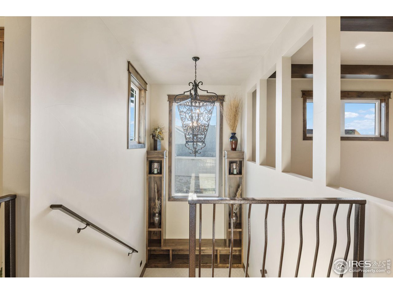 2770 Heron Lakes Parkway Berthoud, CO 80513 - Photo 27 of 40 a view of entryway with chandelier