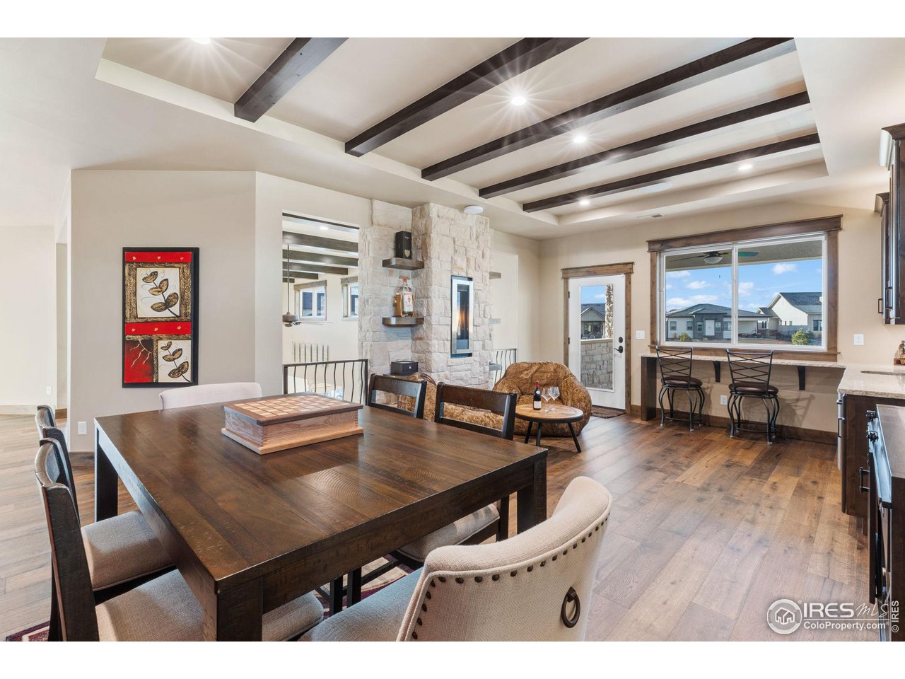 2770 Heron Lakes Parkway Berthoud, CO 80513 - Photo 29 of 40 a living room with furniture and wooden floor