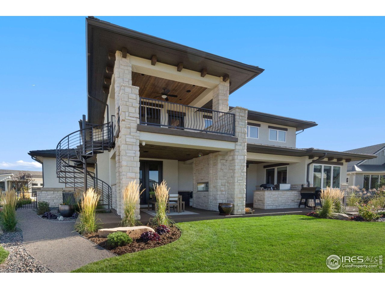 2770 Heron Lakes Parkway Berthoud, CO 80513 - Photo 3 of 40 a front view of a house with a yard