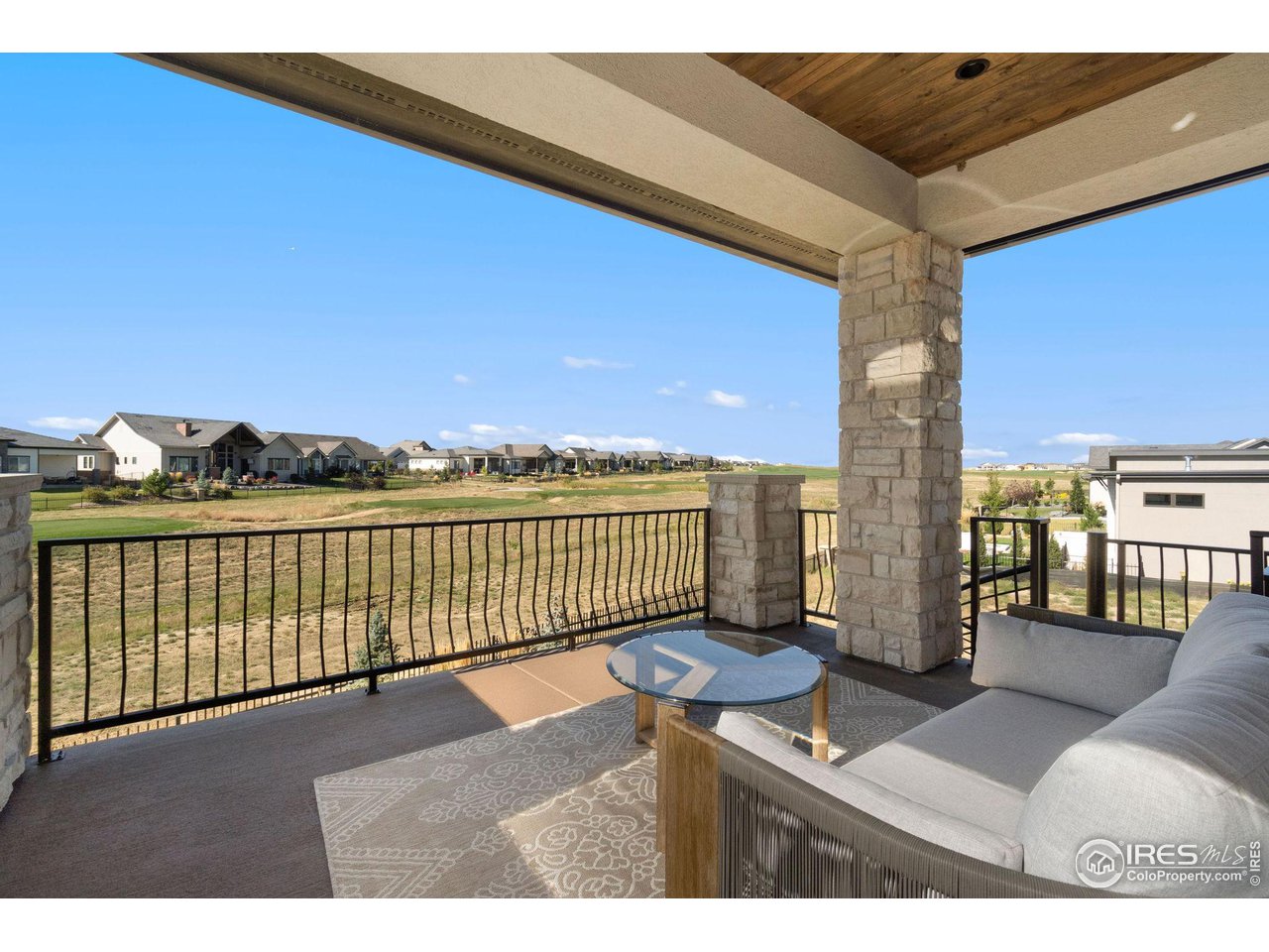 2770 Heron Lakes Parkway Berthoud, CO 80513 - Photo 38 of 40 a view of a terrace with couches and sky view
