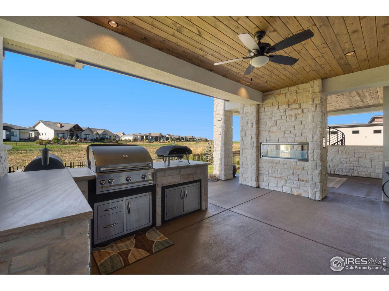 2770 Heron Lakes Parkway Berthoud, CO 80513 - Photo 40 of 40 a living room with furniture and kitchen view