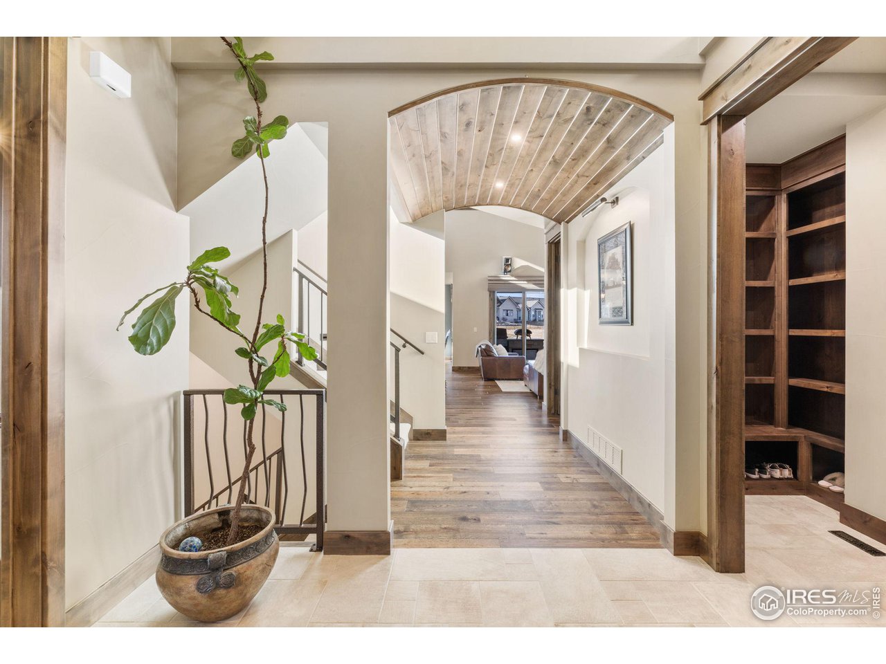 2770 Heron Lakes Parkway Berthoud, CO 80513 - Photo 5 of 40 a view of a hallway with wooden floor and windows