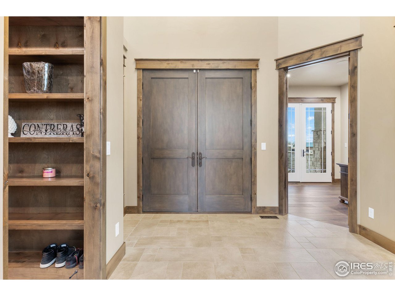 2770 Heron Lakes Parkway Berthoud, CO 80513 - Photo 7 of 40 a view of a hallway with wooden shelves