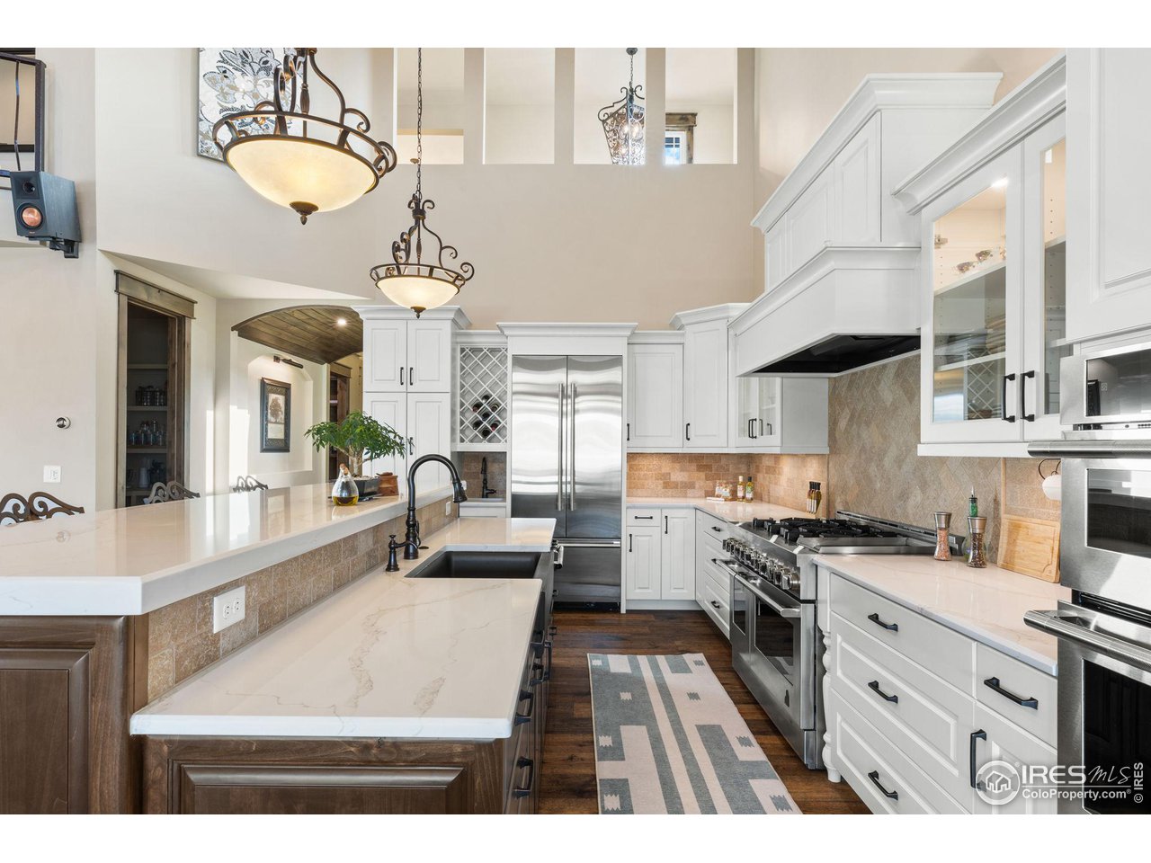 2770 Heron Lakes Parkway Berthoud, CO 80513 - Photo 8 of 40 a kitchen with cabinets appliances and a counter top