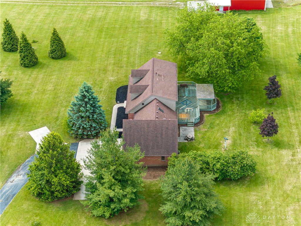 9981 Ridge Acres Lane Englewood, OH 45322 - Photo 58 of 73 This verdant aerial view reveals a charming home nestled among lush trees and expansive lawns.