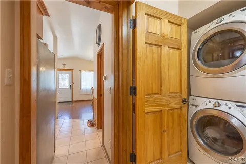 a view of a hallway with washer and dryer