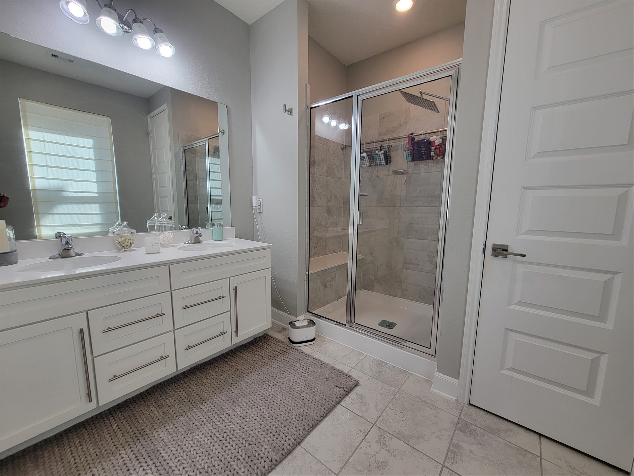 2095 Parnevik Place Conroe, TX 77304 - Photo 13 of 23 Spa-like primary bath with double sinks and large shower.